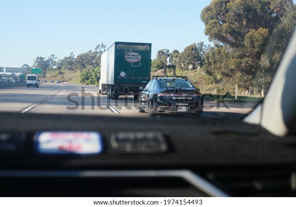 San Diego, CA, USA - May 05 2021:\
A Qualcomm Autonomous driving vehicle on a San Diego\
freeway.