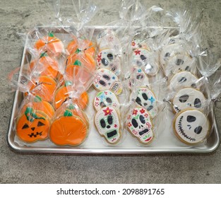 San Diego, CA USA - October 30, 2021: Sugar Cookies With Royal Icing For Halloween In Shape Of Pumpkins, Day Of The Day Skulls And Jack Skellington Face.