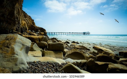 San Diego California Coast Line and Seagulls, Scripps Pier La Jolla Shores in San Diego, California USA - Powered by Shutterstock