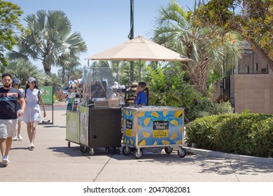 San Diego, California, United States - 09-23-2021: A View Of An Employee Providing Service At A Food Stand Outside A Local Theme Park.