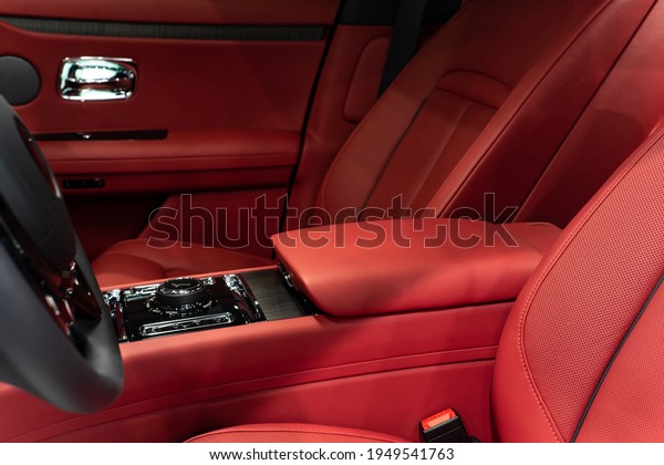 san\
Diego, California united states - march 19th 2021: Black Rolls\
Royce Ghost in exotic dealership interior\
exterior
