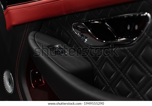 san diego,\
california united states - march 19th 2021: Black Bentley GT in\
exotic dealership interior\
exterior
