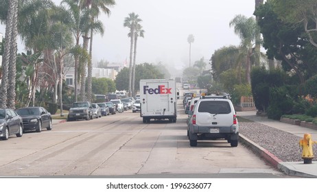 San Diego, California USA - 21 Nov 2020: FedEx Mail Truck On City Street, Neighborhood Residential District. Postal Fed Ex Service Vehicle, Suburban Road. Federal Express Delivery Car For Deliveryman.