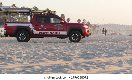 San Diego, California USA - 25 Nov 2020: Lifeguard Red Pickup Truck, Life Guard Auto On Mission Beach. Rescue Pick Up Car On Ocean Coast, Surfing And Public Safety, Lifesavers 911 Vehicle And People.