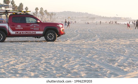 San Diego, California USA - 25 Nov 2020: Lifeguard Red Pickup Truck, Life Guard Auto On Mission Beach. Rescue Pick Up Car On Ocean Coast, Surfing And Public Safety, Lifesavers 911 Vehicle And People.