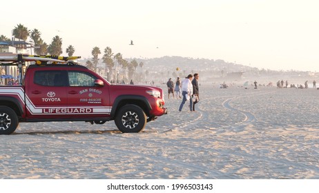 San Diego, California USA - 25 Nov 2020: Lifeguard Red Pickup Truck, Life Guard Auto On Mission Beach. Rescue Pick Up Car On Ocean Coast, Surfing And Public Safety, Lifesavers 911 Vehicle And People.