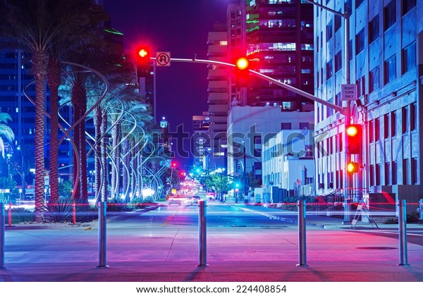 San Diego City Center\
Intersection at Night. Red Lights Traffic Lights. San Diego,\
California, USA.