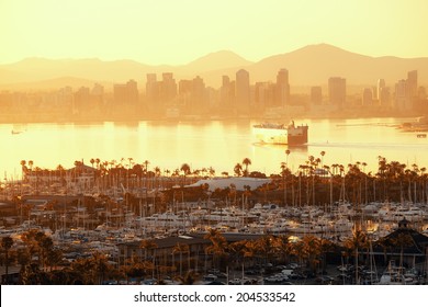 San Diego Downtown Skyline At Sunrise With Boat In Harbor.