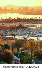 San Diego Downtown Skyline At Sunrise With Boat In Harbor.