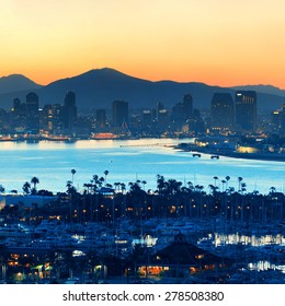 San Diego Downtown Skyline At Sunrise With Boats In Harbor.