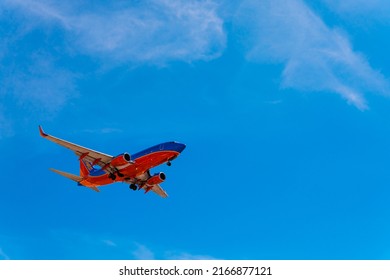 San Diego, USA, 2019. Southwest Airlines Plane Is Flying In Blue Sky