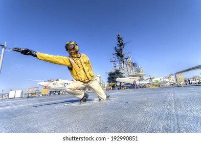 SAN DIEGO,USA - FEBRUARY 24 2014: A Statue Of A Flight Deck Director, Catapult Officer, Signaling Aircrafts Into Position On The Deck, On The USS Midway Museum In San Diego,California, USA