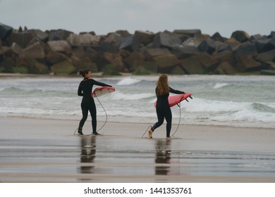 San Sebastián, Donostia / Spain - June 14, 2019: Water Splashes Around Young Surfer Going To Epic Barrel Wave. Extreme Pro Sportsman Surfing A Wave In Basque Autonomous Community In Summer Cloudy Day