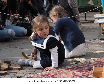 San Felice Sul Panaro, Italy - Magico 2018, Magic Carnival. The Theme Of This Year Was The Silent Movie. Two Little Girls Play On A Carpet.