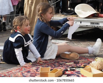 San Felice Sul Panaro, Italy - Magico 2018, Magic Carnival. The Theme Of This Year Was The Silent Movie. Two Little Girls Play On A Carpet.