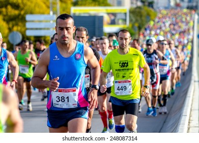 SAN FERNANDO, SPAIN - MAR 23: Unidentified runners on the street during XXVIII Half Marathon Bahia de Cadiz on March 23 , 2014, in San Fernando , Spain