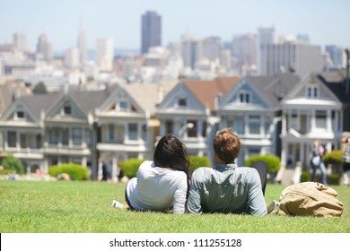 San Francisco - Alamo Square People. Couple In Alamo Park By The Painted Ladies, The Seven Sisters, San Francisco, California, USA.