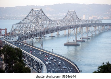 San Francisco Bay Bridge With The City Of Oakland In The Background