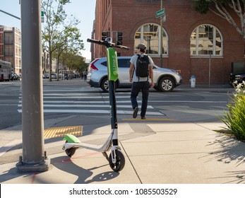 SAN FRANCISCO, CA – APRIL 20, 2018: Lime electric scooter resting at an intersection in San Francisco, CA