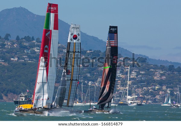 SAN FRANCISCO, CA,\
AUGUST 26: American team and the Corean team try to overtake the\
Italian team in the bay of San Francisco during the final of the\
America\'s Cup 2012.