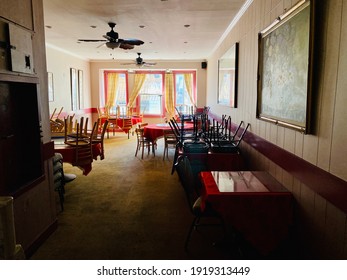 San Francisco, CA - February 6, 2021: Interior Of A Restaurant With Stacked Furniture On Second Floor While Indoor Dining Is Prohibited During Covid 19 Pandemic. 