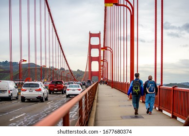 San Francisco, CA - January 8, 2019 : People Walk Through The Golden Gate Bridge On A Cloudy Day.