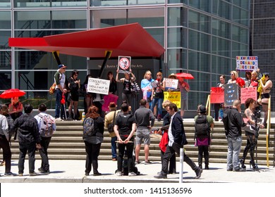 San Francisco, CA - June 01, 2019: Protestors holding signs demonstrating at the Democratic National Convention at Moscone Center.