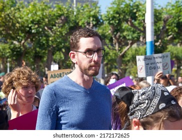 San Francisco, CA - June 24, 2022: Senator Scott Wiener with participants holding signs protesting SCOTUS overturning Roe, removing the right to abortion, in front of city hall.
