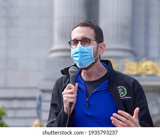 San Francisco, CA - Mar 13, 2021: California State Senator Scott Wiener, wearing a face mask, speaking to participants during the Open the Schools Rally at Civic Center in front of City Hall