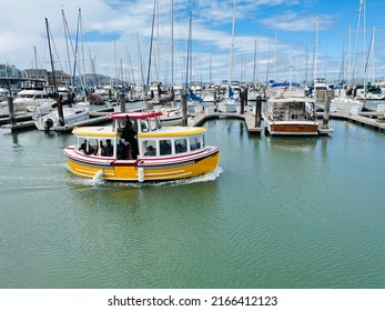 San Francisco, CA - May 28, 2022: Yellow Water Taxi in the marina of Pier 39, taking tourists around.