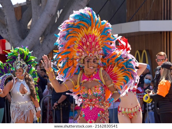 San Francisco, CA - May 29, 2022: Unidentified\
participants in the 44th annual Carnaval Grand parade in the\
Mission District, this years theme, Colores de Amor – Inclusivity,\
Family and Community.