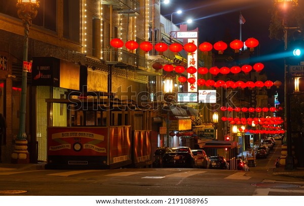 San Francisco, CA, USA - August 10, 2022: Red\
Chinese lanterns hang over Grant Street, welcoming visitors to San\
Francisco\'s Chinatown.