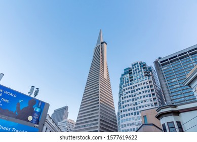 San Francisco, CA, USA, January 5 2019. The TransAmerica Pyramid Center As Seen From An Open Top Tour Bus. Several Other Skyscrapers Can Be Seen And Also A Blue Vodka Billboard