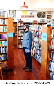 San Francisco, CA, USA March 9 A Man Browses For Books At The City Lights Book Store In San Francisco.  The Store Became The Bub For Jack Kerouac And Other Beat Generation Writers