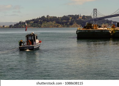 San Francisco, CA / USA - May 08 2018: Scuba Diver Coming Out Of Water Into A Boat In The San Francisco Bay