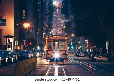San Francisco Cable Car Trolley Tram on California Street at Night with City Lights, USA