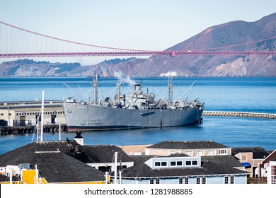 San Francisco, California - October 5, 2017: The SS Jeremiah OBrien War Ship Built During World War II With The Famous Iconic Golden Gate Bridge In Background