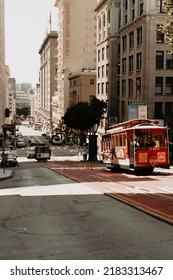 San Francisco, California, United States - June 23 2022: Famous Cable Car Going Downhill On The Street In Downtown San Francisco, A Tourist Attraction And Landmark. 