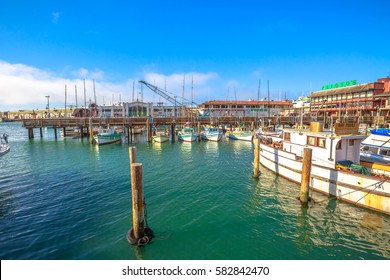 San Francisco, California, United States - August 14, 2016: boats docked at Pier 39, Fisherman's Wharf district. San Francisco travel summertime. Pier 39 Marina waterfront. Popular tourist attraction.