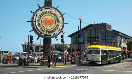 SAN FRANCISCO, CALIFORNIA, USA - AUGUST 30, 2015: a green and yellow street car at fisherman's wharf in san francisco