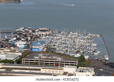 San Francisco, California, USA - December 24, 2015: Pier 39 is a popular tourist attraction with shops, restaurants, street performance, Aquarium of the Bay and marina in San Francisco, California.