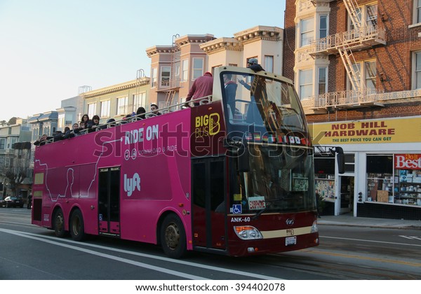 San Francisco, California, USA - December 23,\
2015: Big Bus Tours, the largest operator of open-top bus\
sightseeing tours in the world, is taking tourists around San\
Francisco\'s major\
landmarks.
