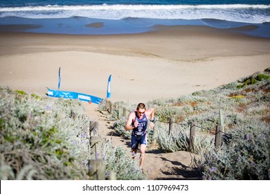 San Francisco, California, USA - June 3, 2018: Jason West Makes Running Up A Cliff Made Of Sand Look Easy En Route To His Third Place Finish At The 2018 Escape From Alcatraz Triathlon.