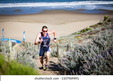 San Francisco, California, USA - June 3, 2018: Jason West Makes Running Up A Cliff Made Of Sand Look Easy En Route To His Third Place Finish At The 2018 Escape From Alcatraz Triathlon.