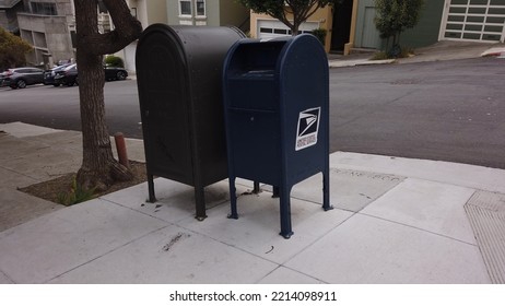 San Francisco, California, USA, June 29, 2022: The United States Postal Service Blue Mailbox Sitting On An Urban Sidewalk.