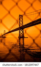 San Francisco, California, USA, September 09, 2020, San Francisco Downtown Bay Bridge Orange Yellow Glow Air Pollution Pacific Ocean Vertical