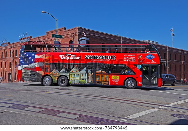 SAN FRANCISCO, CALIFORNIA/USA - MAY 25, 2017:\
An Open City Tour open topped bus. The sightseeing bus tour\
operates in more than 100 cities globally, is taking tourists to\
the major landmarks.