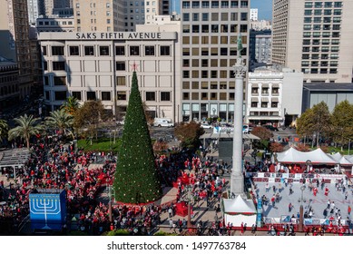 San Francisco, California/USA-12/8/18: Union Square Park Christmas Time During Santa Con And Toys For Tots Seen From A Birds Eye View Above Showing Flash Mob Christmas Tree And Surrounding Stores