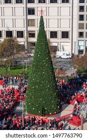 San Francisco, California/USA-12/8/18: Union Square Park Christmas Time During Santa Con And Toys For Tots Seen From A Birds Eye View Above Showing Flash Mob Christmas Tree And Surrounding Stores