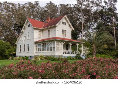 San Francisco, California/USA-2/22/20: Presidio Historical Military Built Building  Surrounded By Tall Eucalyptus Trees Green Natural Flowering Foilage A Military Base Now The Presidio National Park